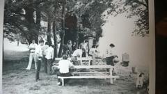 First annual programming staff cookout, Gene Dugger at right in football jersey cooking WP_20140216_007.jpg